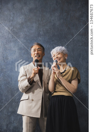 Smiling senior couple with arms crossed 134687673
