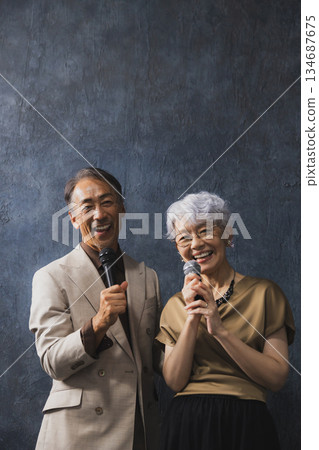 Smiling senior couple with arms crossed 134687675