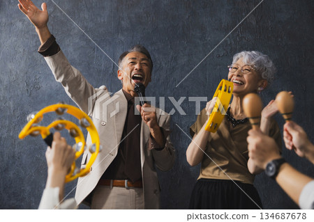 Smiling senior couple with arms crossed 134687678