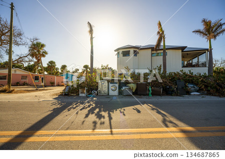 Piles of garbage from severely damaged homes after hurricane Milton storm surge in Florida. Debris on street side on Manasota Key in Englewood. Hurricane aftermath cleanup 134687865