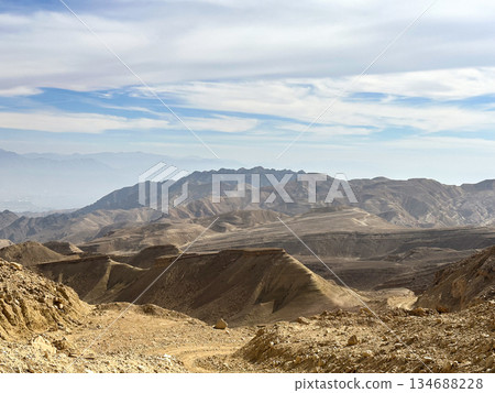Eilat Mountains desert landscape with layered sedimentary cliffs Eilat Mountains desert landscape with layered sedimentary cliffs 134688228