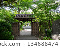 The Kido Gate of Mukojima Hyakkaen Gardens, surrounded by fresh greenery, and a Japanese garden in summer 134688474