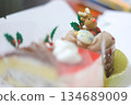 A cute Christmas chocolate cake decorated with reindeer 134689009