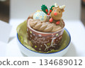 A cute Christmas chocolate cake with reindeer-shaped candy as the highlight 134689012
