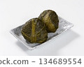 Rice balls wrapped in mustard greens 134689554