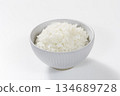White rice in a bowl placed on a white background 134689728