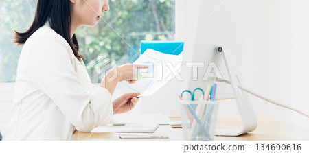 A young woman creating documents A young woman creating documents 134690616