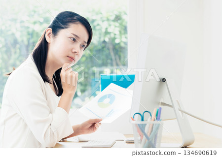 A young woman creating documents A young woman creating documents 134690619