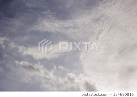 Wispy Clouds in a Pale Sky. Cloudy Sky. dreamlike Background. Climate Concept. . High quality photo 134690816