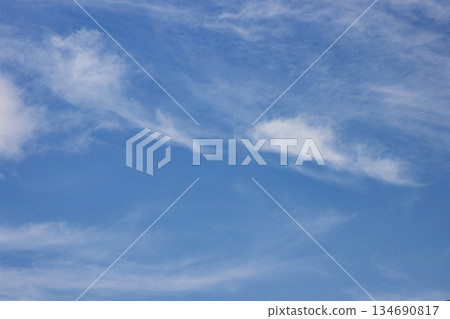 Expansive Blue Sky with Delicate Cirrus Clouds. Daylight sky background. cloudscape atmosphere. Climate and Nature Concept. High quality photo 134690817
