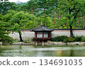 Traditional Korean Pavilion Hyangyangjeong in the Serene Gardens of Gyeongbokgung Palace Surrounded by Lush Greenery and Mountains 134691035
