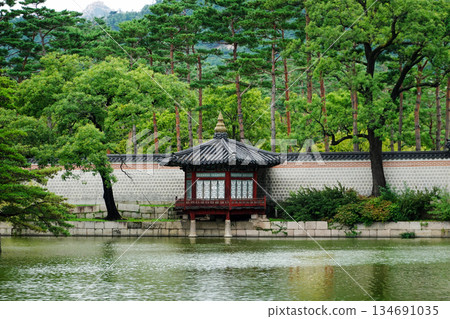 Traditional Korean Pavilion Hyangyangjeong in the Serene Gardens of Gyeongbokgung Palace Surrounded by Lush Greenery and Mountains Traditional Korean Pavilion Hyangyangjeong in the Serene Gardens of Gyeongbokgung Palace Surrounded by Lush Greenery and Mountains 134691035