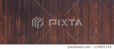 Dark Wooden Plank Surface With Natural Texture and Grain Patterns 134691378