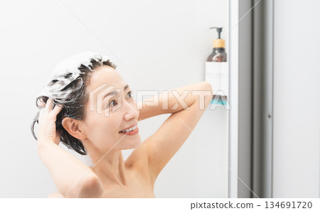 Woman shampooing beauty image Woman shampooing beauty image 134691720