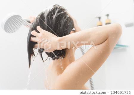 Woman shampooing beauty image Woman shampooing beauty image 134691735