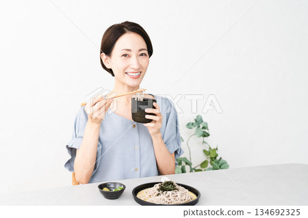 Woman eating Zaru Soba noodles Lifestyle image 134692325