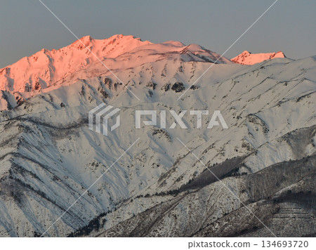 Beautiful morning glow on Mt. Karamatsu in Hakuba Village, Nagano Prefecture (aerial shot by drone) Beautiful morning glow on Mt. Karamatsu in Hakuba Village, Nagano Prefecture (aerial shot by drone) 134693720