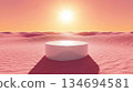 A cylindrical white podium in a pink sand desert 134694581