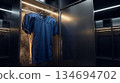 professional sports jersey hanging in a dimly lit, high-tech locker room 134694702