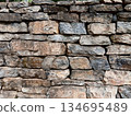 Background and Texture from Vintage red brick and stone wall is deteriorating 134695489