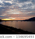 Silhouette Lao Nippon Bridge with mountain with cloud and  sky in magic hour at sunrise at Mekong River in Pakse, Laos 134695493