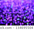 Abstract Bokeh from indoor lighting, Pink with blue with red with white and purple circles, Night city light background for celebration of christmas and holiday season 134695504