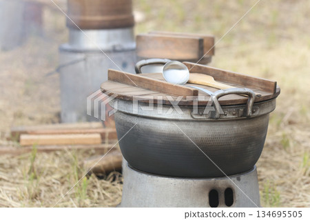 Cooking outdoors Cooking outdoors 134695505