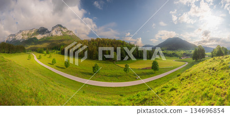 Meadow with road and bench during sunset in Berchtesgaden National Park 134696854