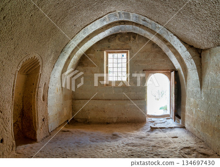 Rock-cut mosque interior with arched architecture, Zelve Valley Open Air Museum, Cappadocia, Turkey. Rock-cut mosque interior with arched architecture, Zelve Valley Open Air Museum, Cappadocia, Turkey. 134697430