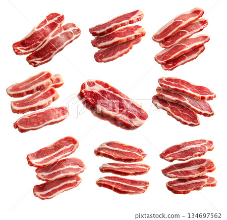 Set of of fresh pork slices displayed isolated on white background, showcasing texture and quality 134697562
