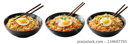 Spicy fried rice Nasi Goreng garnished with fresh green onions and topped with fried egg in bowl, isolated on white 134697705