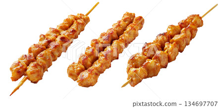 Grilled chicken Satay skewer with a golden brown glaze, isolated on white background, concept of tasty street food 134697707