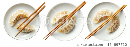 Pan-fried or steamed dumplings Jiaoz arranged on a wooden plate, isolated on white background, concept of Asian cuisine 134697710