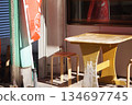Terrace seats in front of the store 134697745