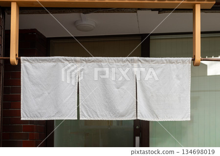 The curtain-like fabric that hangs in front of traditional Japanese restaurants and shops not only serves as a signboard, but holds a larger meaning, 134698019