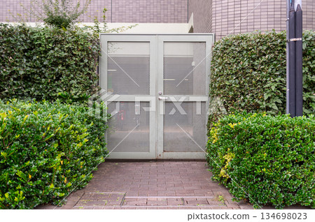 sidewalk by street wall  and  door 134698023