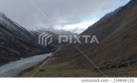 Majestic mountain valley landscape with river and rocky terrain 134698128