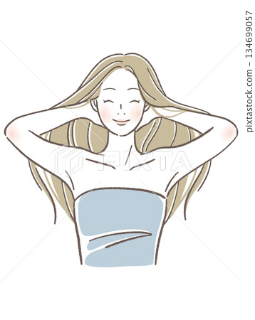 Woman brushing her hair with a smile 134699057