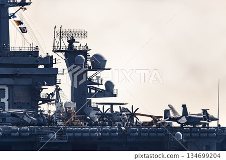 The U.S. Navy nuclear-powered aircraft carrier USS George Washington departs from Yokosuka Naval Base in Kanagawa Prefecture and sails through the Uraga Strait in Tokyo Bay. 134699204