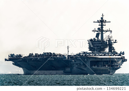 The U.S. Navy nuclear-powered aircraft carrier USS George Washington departs from Yokosuka Naval Base in Kanagawa Prefecture and sails through the Uraga Strait in Tokyo Bay. 134699221