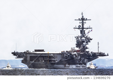 The U.S. Navy nuclear-powered aircraft carrier USS George Washington departs from Yokosuka Naval Base in Kanagawa Prefecture and sails through the Uraga Strait in Tokyo Bay. 134699270