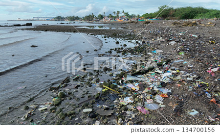 Garbage plastic beach sea waste Cebu landfill ocean pollution bottles coast water trash fishermen litter boats poor people shanty fishing nets Philippines Taytay children people fish landscape place Garbage plastic beach sea waste Cebu landfill ocean pollution bottles coast water trash fishermen litter boats poor people shanty fishing nets Philippines Taytay children people fish landscape place 134700156