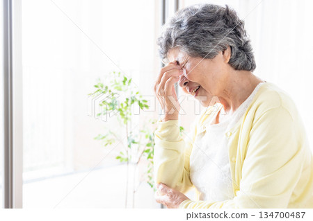 Senior with tired eyes 134700487