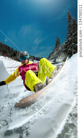 Trendy artwork snowboarder riding curved snow wall in mountains. 134700511