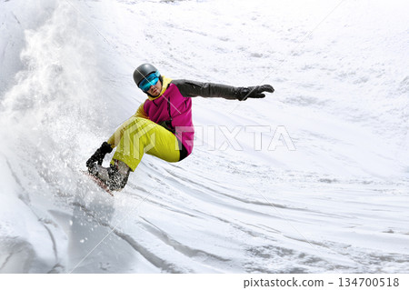 Powerful motion design of snowboarder carving fast turn on steep slope. Powerful motion design of snowboarder carving fast turn on steep slope. 134700518