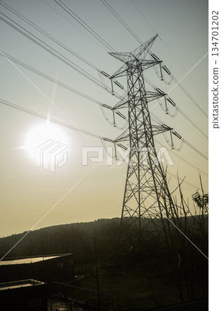 A view of electric poles on sunset time A view of electric poles on sunset time 134701202