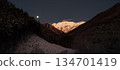 A fantastic pre-dawn cold moon and snow-covered Mount Tanigawa 134701419