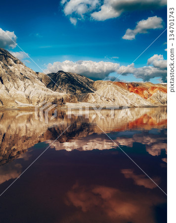 Beautiful landscape with a lake in a clay quarry Beautiful landscape with a lake in a clay quarry 134701743