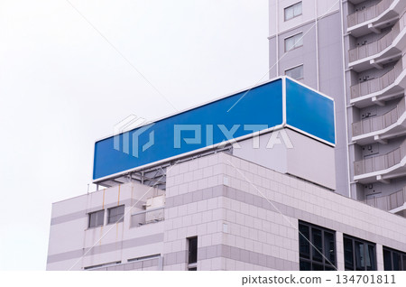 Large blank billboard on a street wall, banners with room to add your own text 134701811