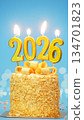 Happy New Year 2026, cute cake with golden ribbon with candle number 2026 for new year celebrate party was lit. blue background with light bokeh, vertical 134701823